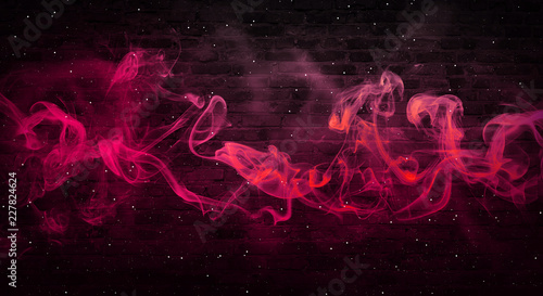 colorful smoke on a black background. Empty background of black brick wall, neon light, smoke.