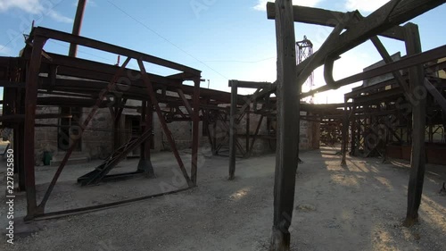 Second station, Cable Car Chilecito - La Mejicana gold mine in Famatina mountains. Walking at sunset through external construction of iron rails, wagons, wheels. National industrial heritage. La Rioja photo