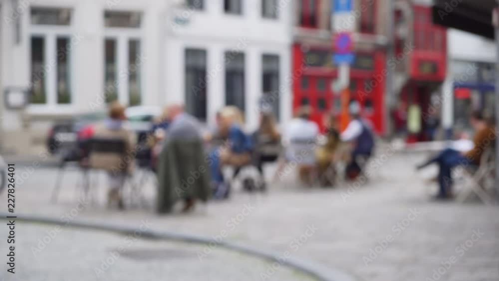 Out of focus background plate of cafe patio street scene for compositing Out of focus background plate of cafe patio street scene for compositing