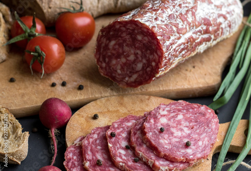 Dark food background with sausage