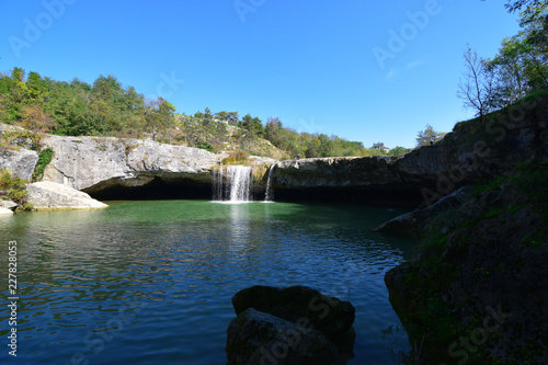 Zarecki krov (Zarečki krov) is a cave below a 10-meters high waterfall below which a deep pond is positined. It is one of the most interesting attractions close to Pazin, Istria (Istra), Croatia. photo