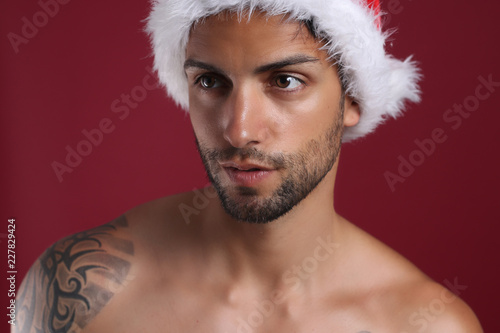 Sexy santa claus . Christmas concept on red background 