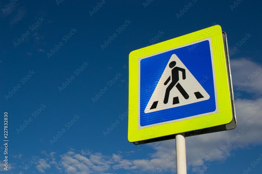 road sign pedestrian crossing against the blue sky road sign pedestrian crossing against the blue sky