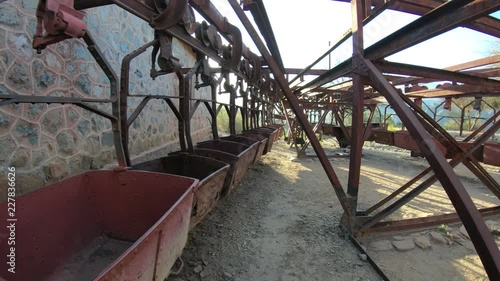 Second station, Cable Car Chilecito - La Mejicana gold mine in Famatina mountains. Walking at sunset along aligned hanging wagons. Flares and blacklight. National industrial heritage. La Rioja photo