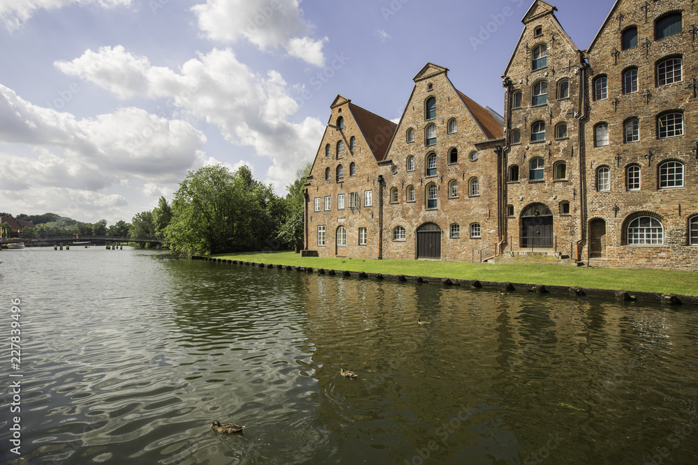 Obraz premium Facade of old buildings near the river, in Lubeck, Germany