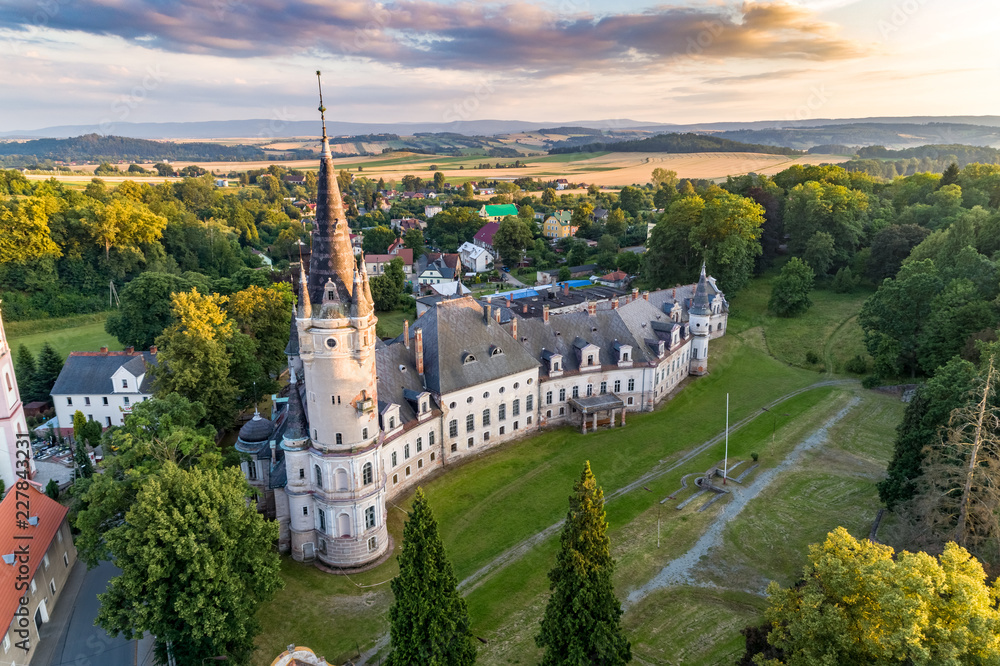 Fototapeta premium Bozkow palace on the panorama of sudety mountains aerial view