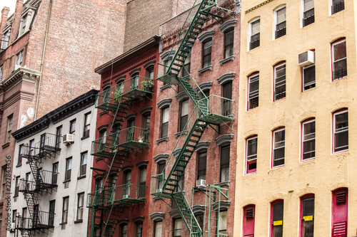 Old colorful buildings with fire escape, New York City, USA