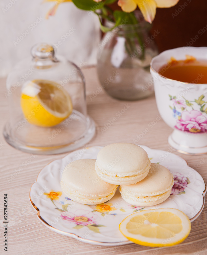 Lemon macaroon and cup of tea Lemon macaroon and cup of tea