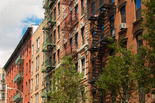 Old colorful buildings with fire escape in Little Italy, New York City, USA