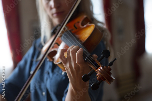 Violin player violinist classical music playing. Orchestra musical instruments
