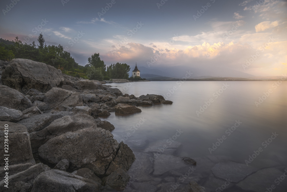 Rocky Beach of Liptovska Mara Lake in Slovakia at Sunset Rocky Beach of Liptovska Mara Lake in Slovakia at Sunset