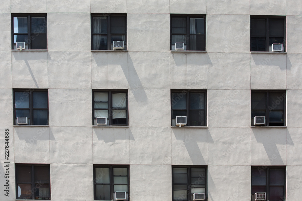 Fototapeta premium front of an old office building with air conditions hanged on windows, Manhattan, New York