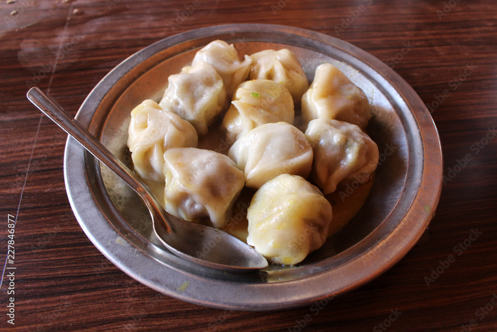 A plate of Momo, the South Asian or Tibetan style dumpling A plate of Momo, the South Asian or Tibetan style dumpling