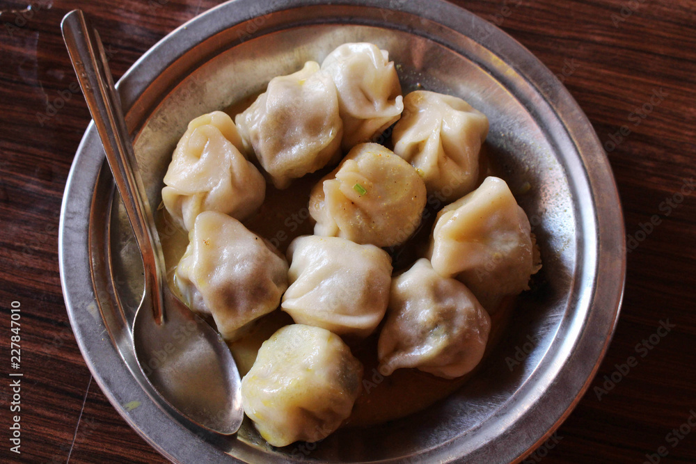 A plate of Momo, the South Asian or Tibetan style dumpling A plate of Momo, the South Asian or Tibetan style dumpling
