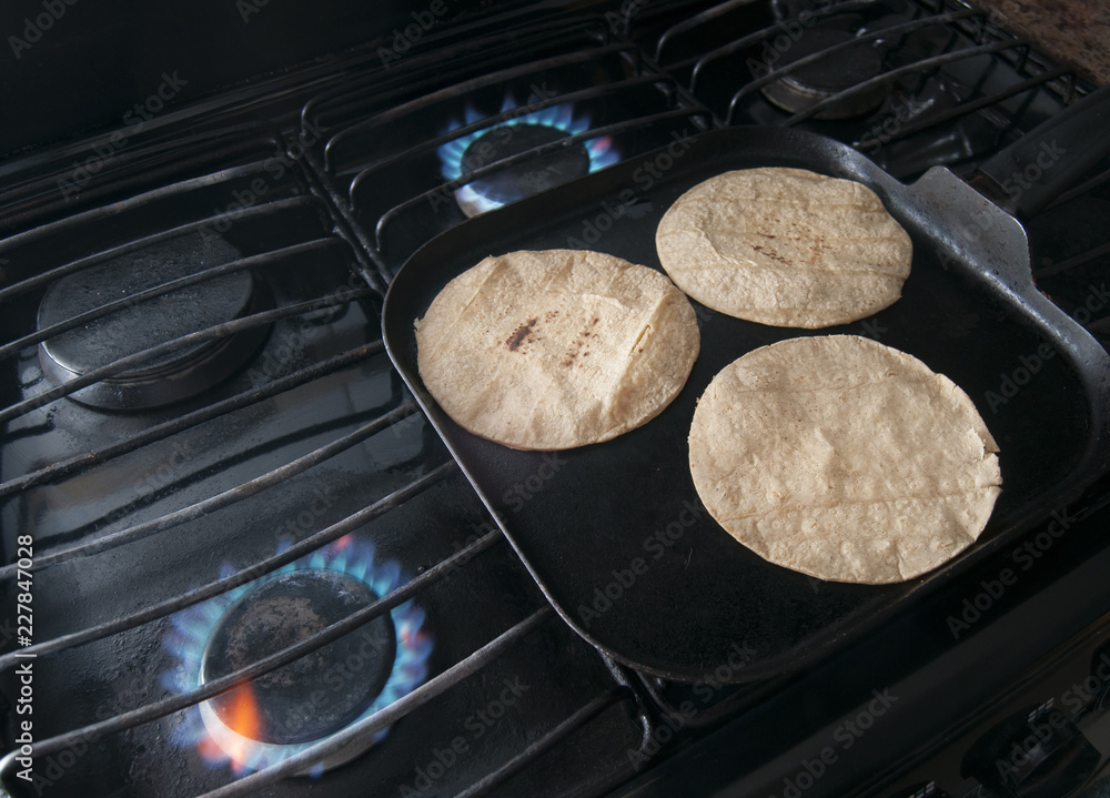 Tortillas on hot comal for mexican food Stock Photo