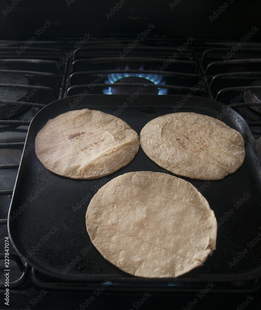 Tortillas on hot comal for mexican food Stock Photo