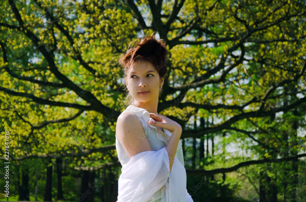 young Oriental woman in white clothes for a walk young Oriental woman in white clothes for a walk