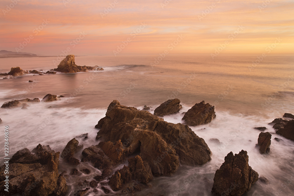 nugget point jets rocks out into the Pacific ocean during a sunrise nugget point jets rocks out into the Pacific ocean during a sunrise