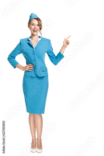 Portrait of charming stewardess wearing in blue uniform. Isolated on white background. photo