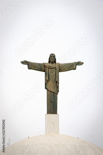 Statue of Christ the Redeemer in the fog.  Mount Isabel de Torres, Puerto Plata, Dominican Republic photo
