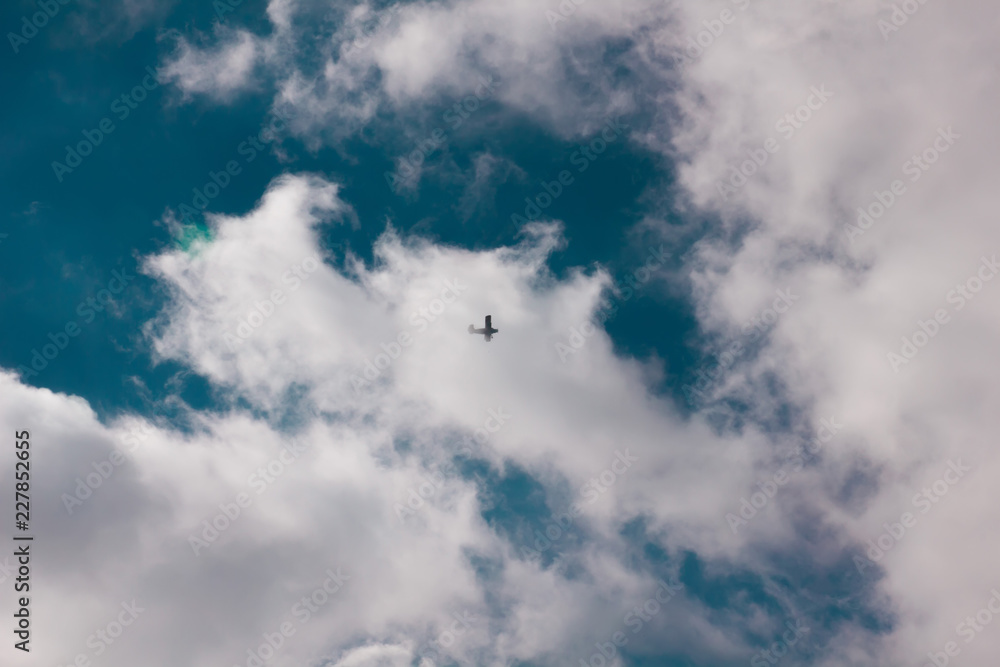 sun and cumulus white clouds against a beautiful blue sky, fly plane sun and cumulus white clouds against a beautiful blue sky, fly plane