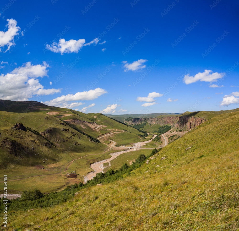 Naklejka premium Asphalt road for cars in the foothills of the North Caucasus in Russia.
