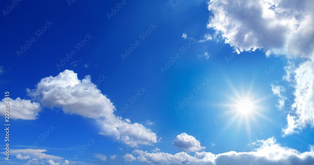 conceptual background image of blue sky with clouds and shining sun - obrazy, fototapety, plakaty 