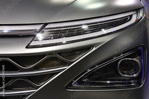 Part of front mask and slim LED headlight of modern korean hydrogen fuel cell SUV car photo