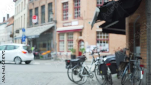 Wallpaper Mural Blurry background plate of Bruges street corner with bicycles and store fronts Torontodigital.ca