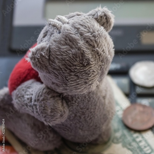Toy, money and calculator.