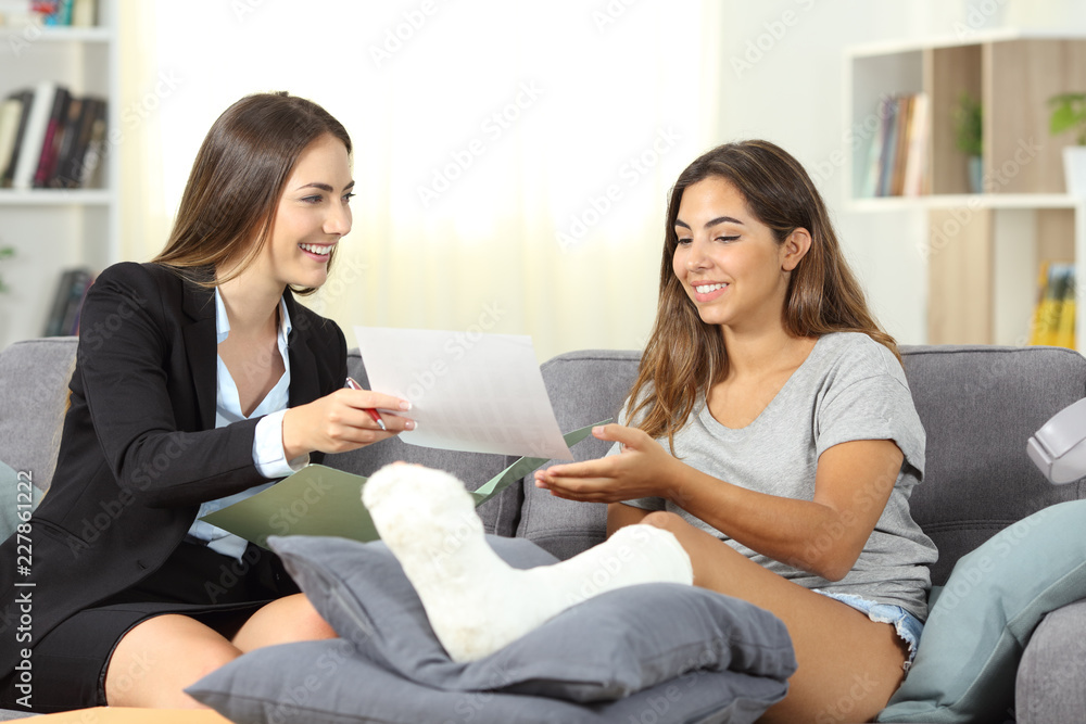 Insurance agent giving notification to a disabled girl Insurance agent giving notification to a disabled girl