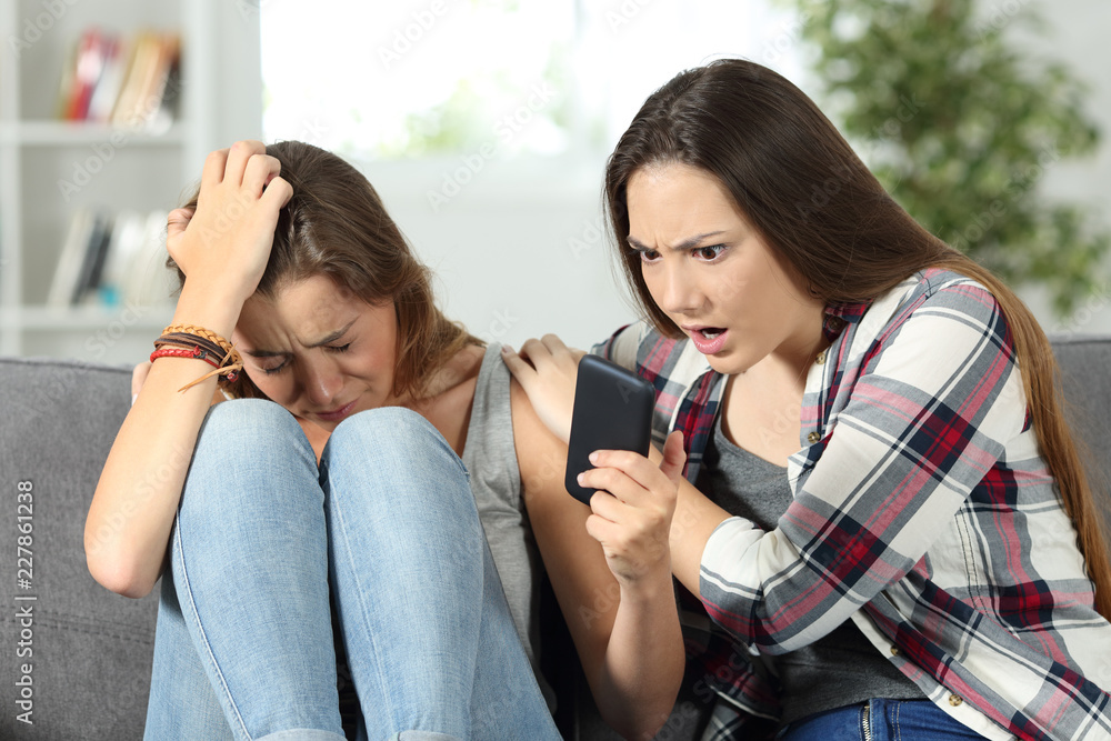 Sad girl showing to a friend online bad news Sad girl showing to a friend online bad news