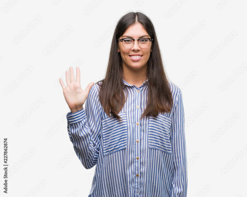 Young beautiful hispanic business woman showing and pointing up with fingers number five while smiling confident and happy.