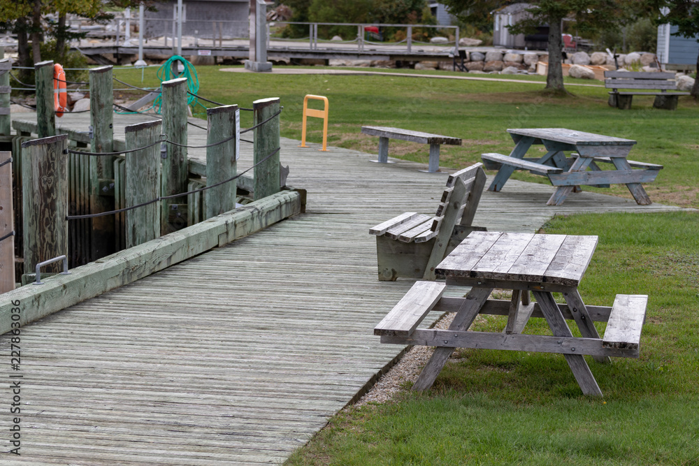 bench in the park with wooden pathway, marina bench in the park with wooden pathway, marina