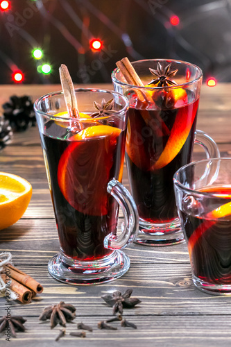 Mulled wine with cinnamon, citrus and anise stars, vertical image