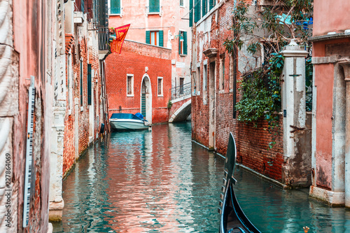 The colorful canals of Venice in Italy, traditional gondola boat