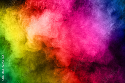 Fototapeta Naklejka Na Ścianę i Meble -  abstract colored dust explosion on a black background.abstract powder splatted background,Freeze motion of color powder exploding/throwing color powder, multicolored glitter texture.