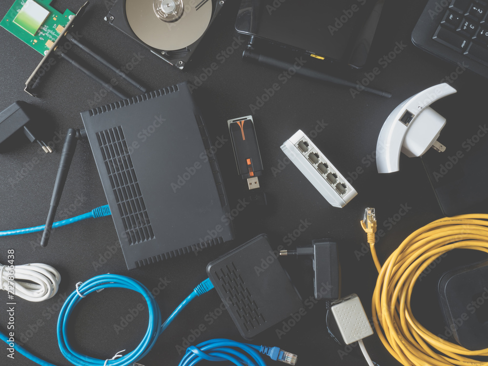 top view of Computer Network Devices concept with Hub, Switch, Router, Modem,  wireless repeater, wireless card, lan cable, USB wifi adapter on black  table background Stock Photo | Adobe Stock