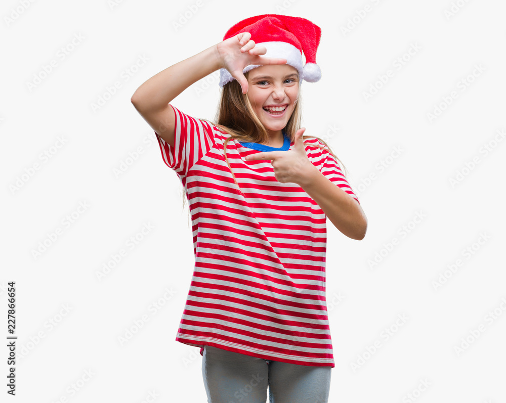Young beautiful girl wearing christmas hat over isolated background smiling making frame with hands and fingers with happy face. Creativity and photography concept. Young beautiful girl wearing christmas hat over isolated background smiling making frame with hands and fingers with happy face. Creativity and photography concept.