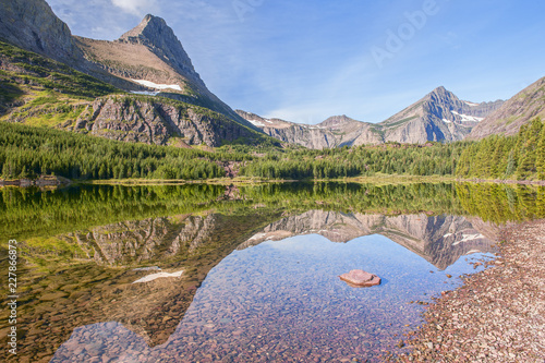 View of Mount Grinnell across Redrock Lake in the Many Glacier Area.Glaicer National Park.Montana.USA photo