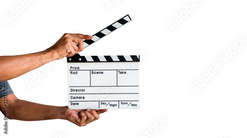 Fényképezés Hand holding a film clapboard slate or movie slate isolated on white background, with clipping path