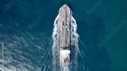 Large crude oil tanker roaring across The Mediterranean sea - Aerial footage following the ship