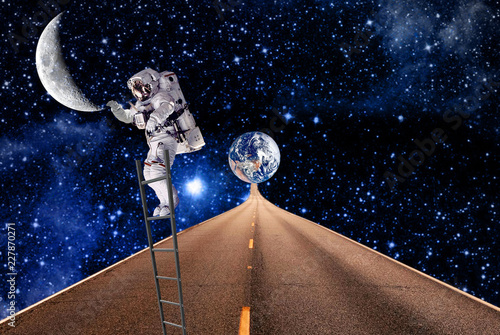 the cosmonaut traveling on moon.elements of this image furnished by NASA