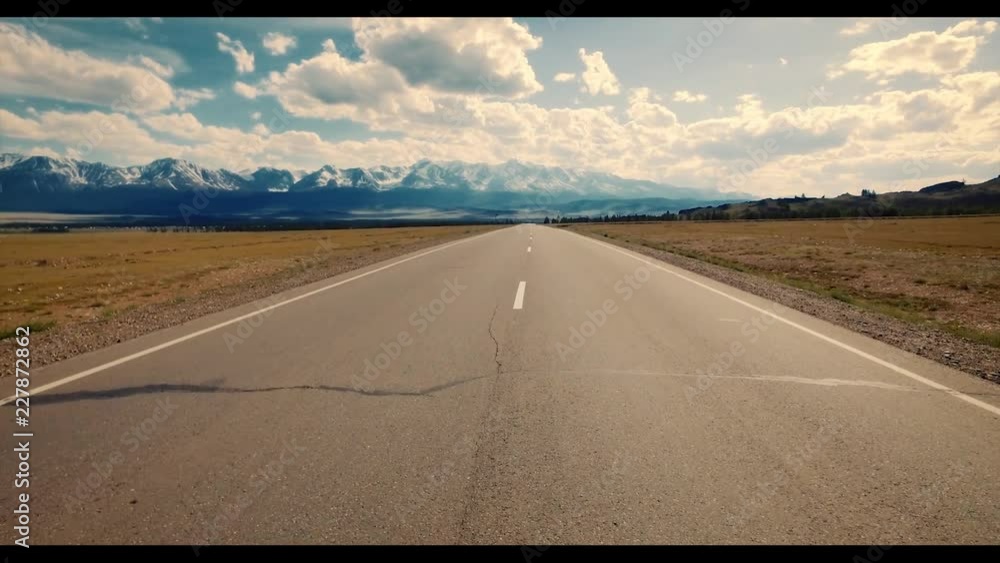 Empty rural road and mountain at background.