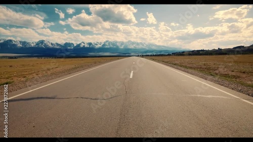 Empty rural road and mountain at background.