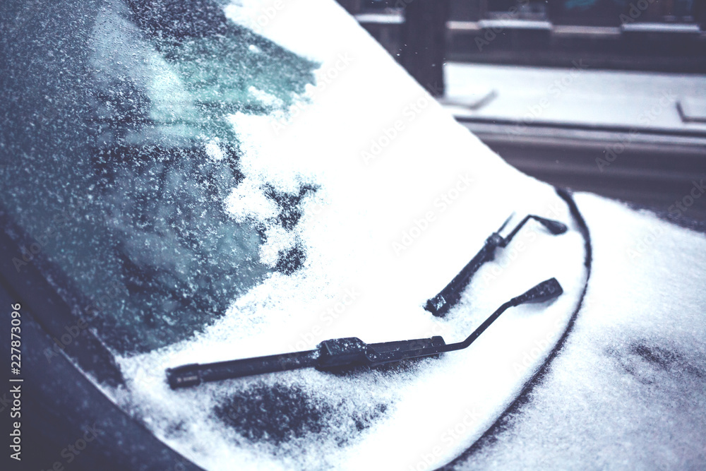 A car in the snow. A car in the snow.