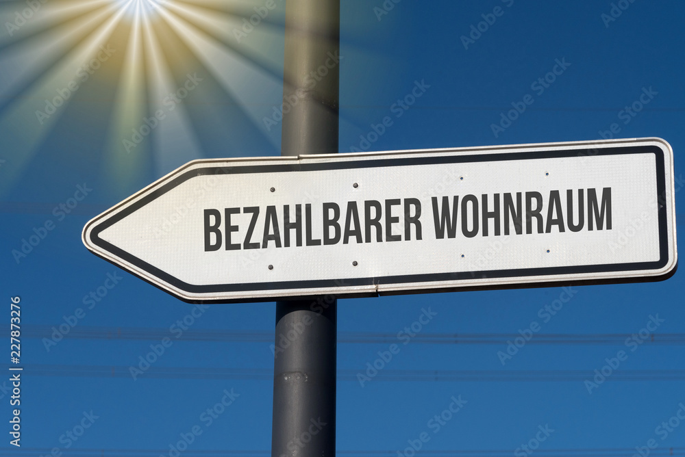 Ein Richtungspfeil und Hinweis auf bezahlbarer Wohnraum Ein Richtungspfeil und Hinweis auf bezahlbarer Wohnraum