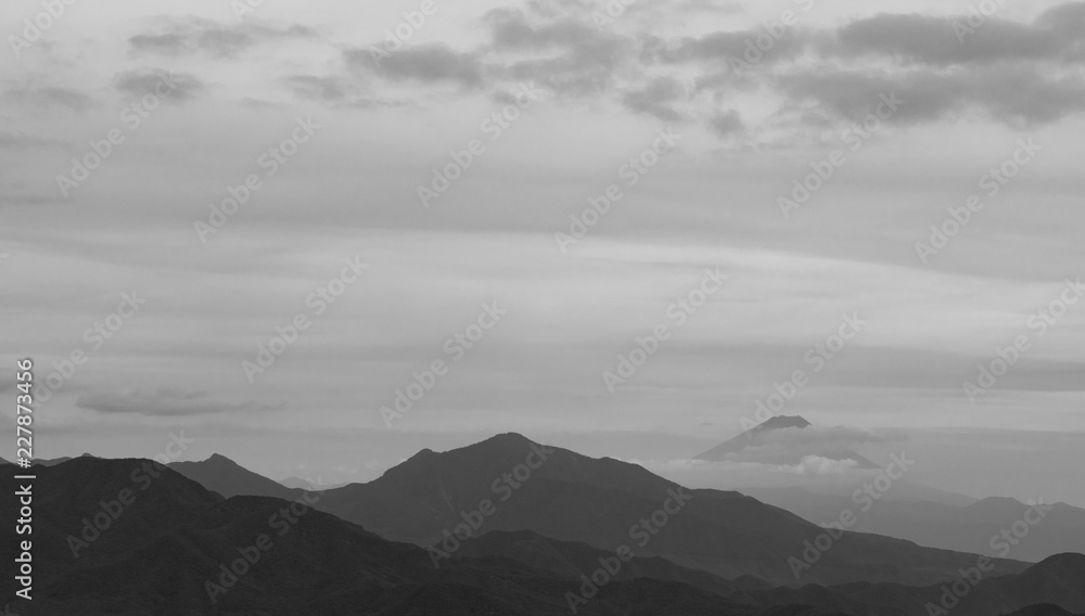 Mountains, with Mt. Fuji hiding behind clouds just behind Mountains, with Mt. Fuji hiding behind clouds just behind