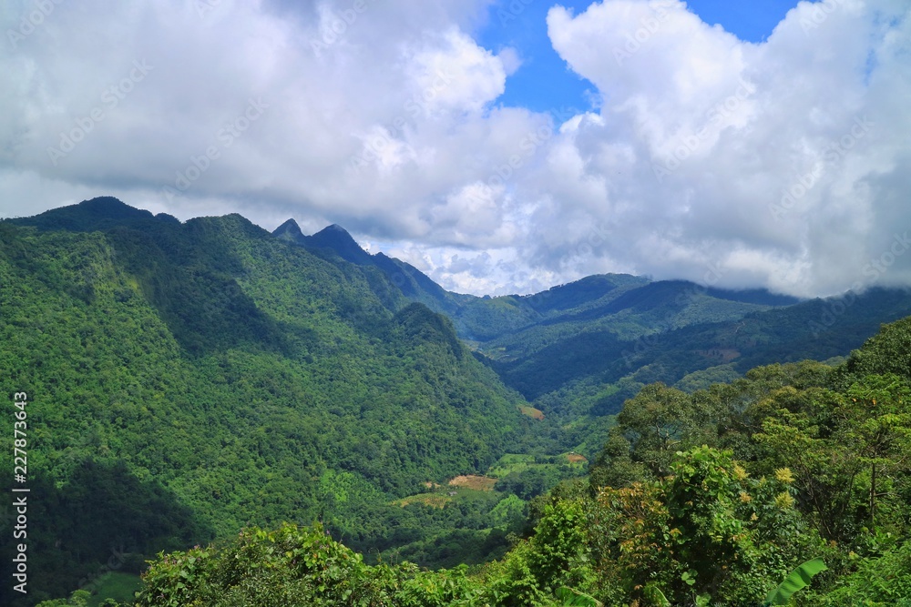 Beautiful landscape view of the mountains with clouds and blue sky in the countryside of Thailand. Beautiful landscape view of the mountains with clouds and blue sky in the countryside of Thailand.