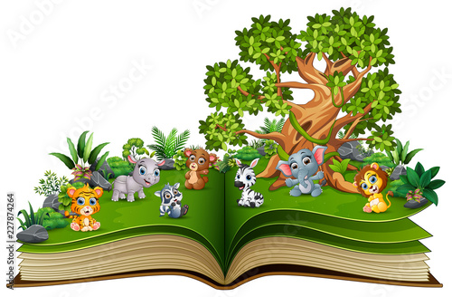 Open book with animal cartoon playing in the park  under a big tree
